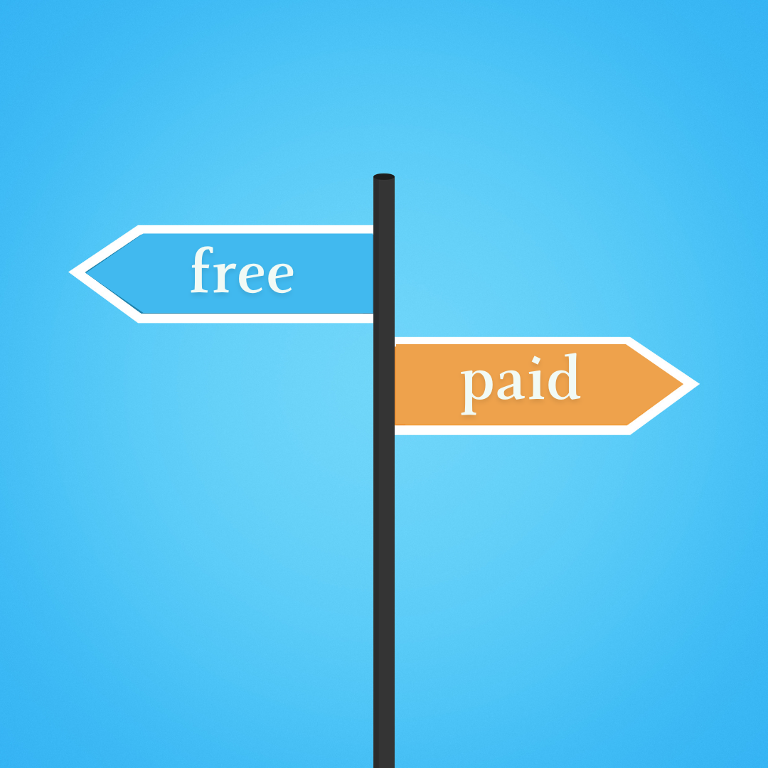 signpost pointing two differections; free and paid to symbolize paid and free bigcommerce themes