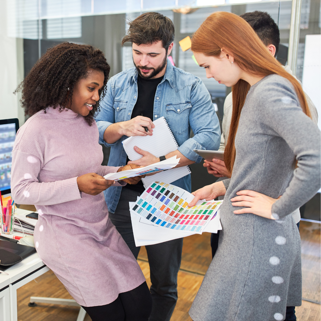 A BigCommerce website designer team working on color schemes