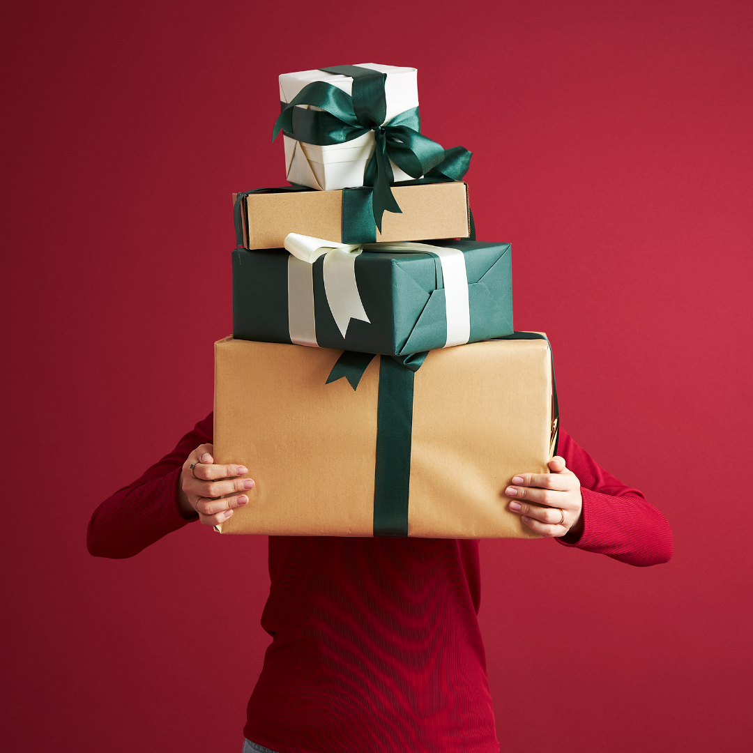 BigCommerce BOPIS shopper behind boxes of gifts she picked up